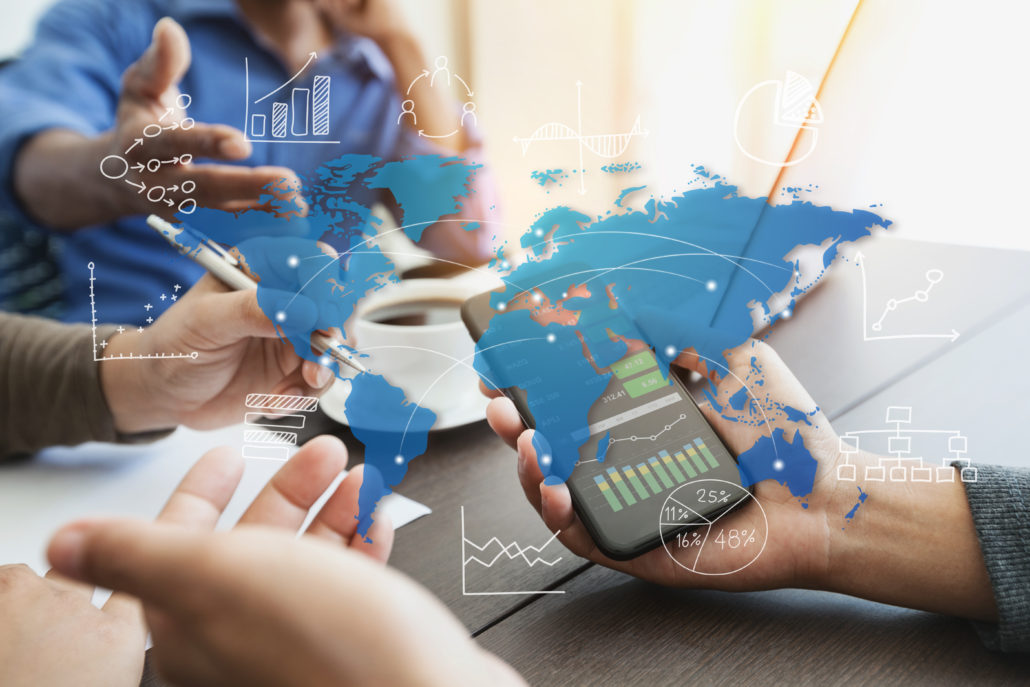 emplyees discussing global data results on a smartphone