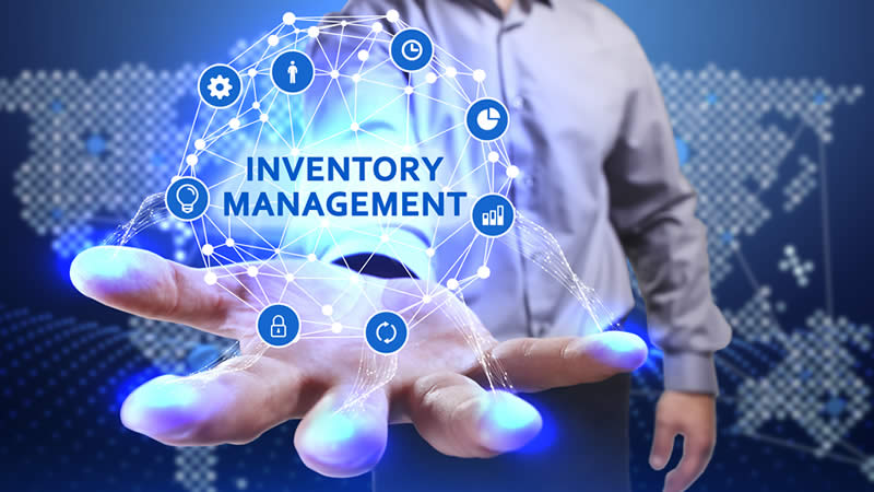 a man holding a graphic with information about inventory management